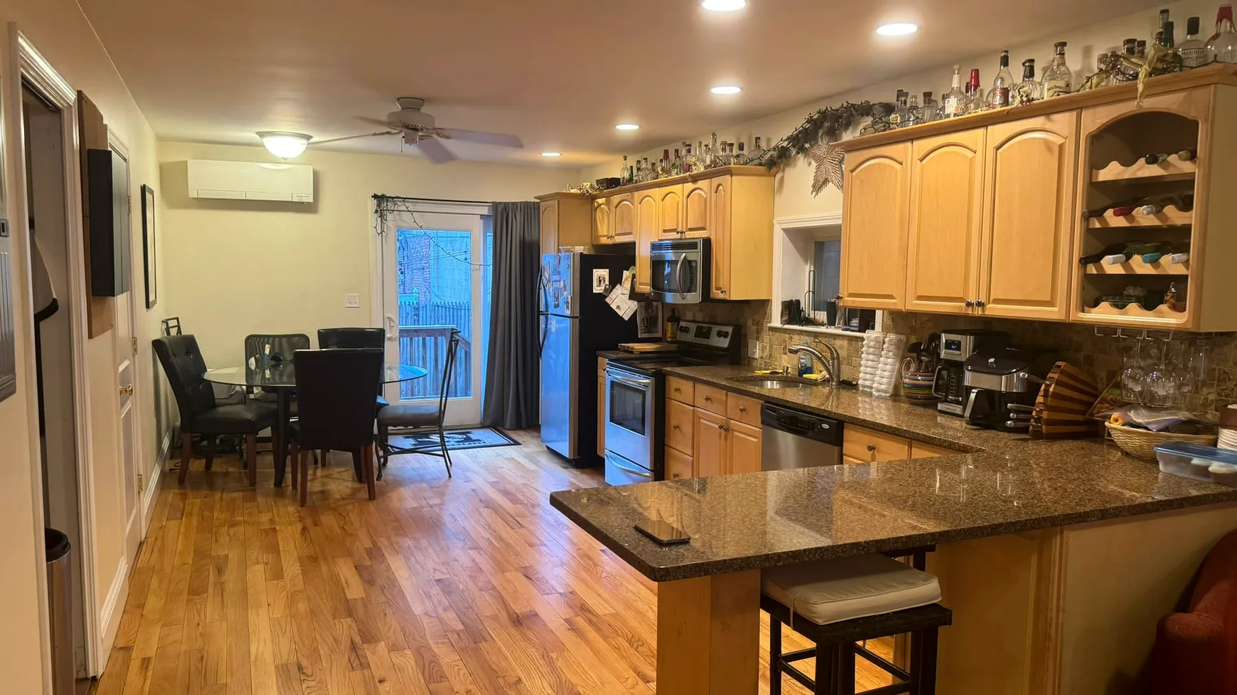 A fully cleaned residential kitchen with polished hardwood floors and finished surfaces