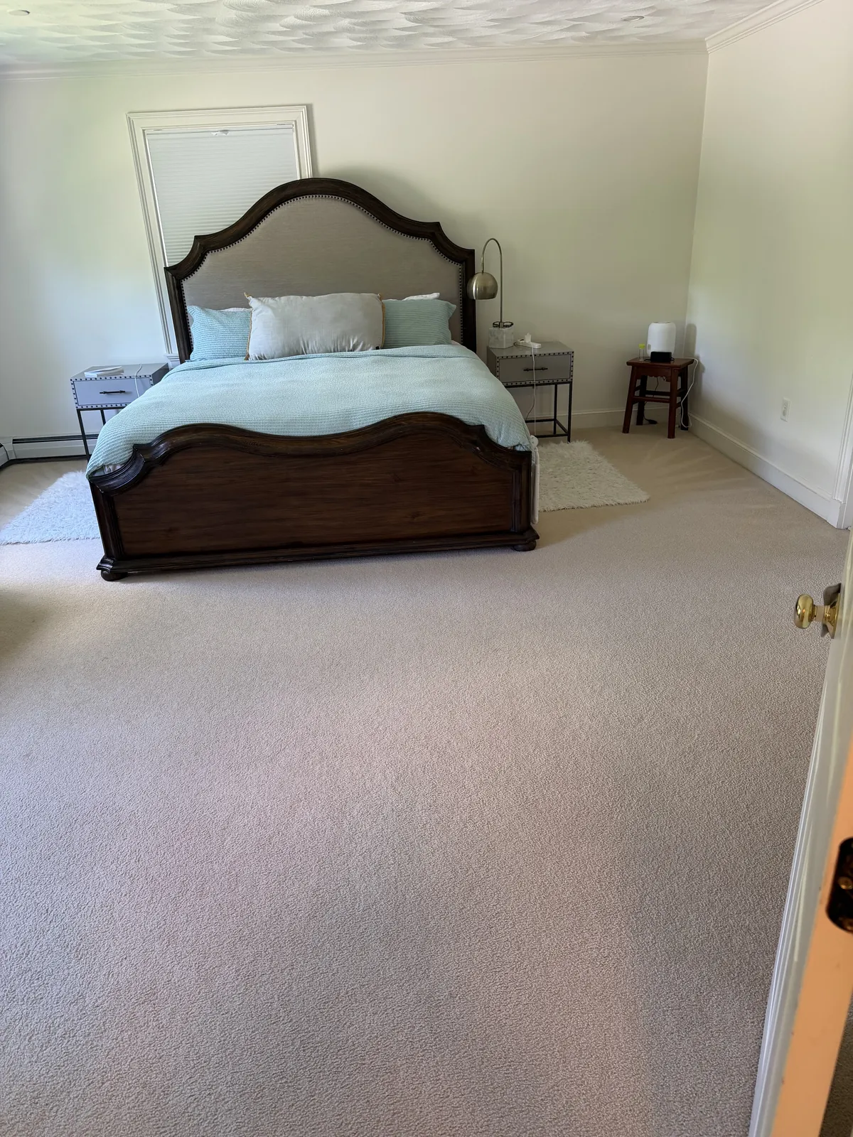 A bedroom fully prepared after residential cleaning